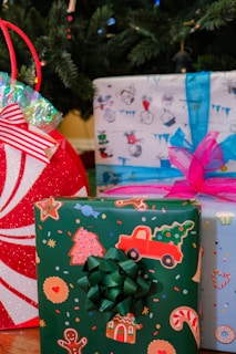 Children eagerly opening colorful wrapped toys under a sparkling Christmas tree.