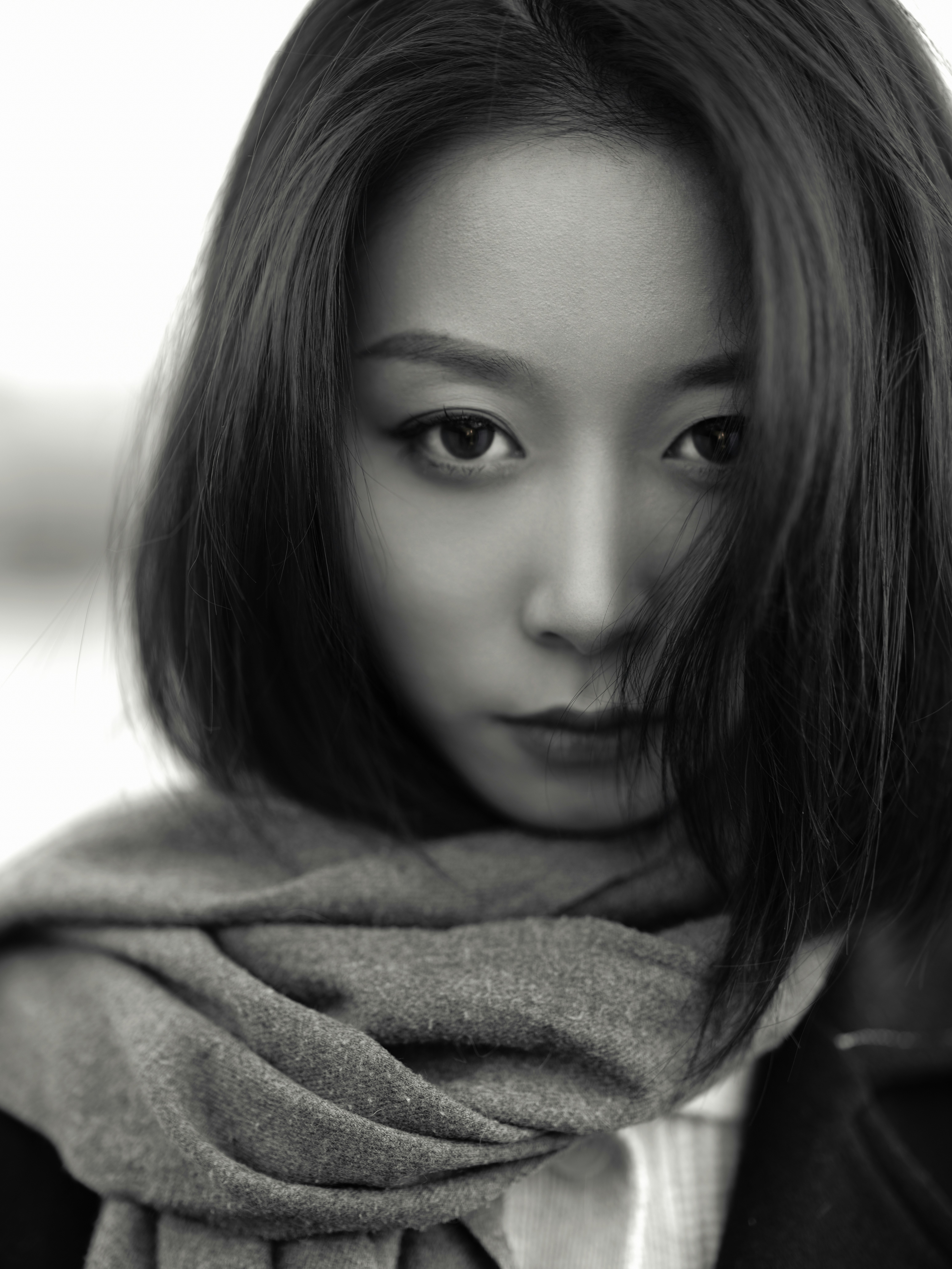 a woman with a scarf around her neck