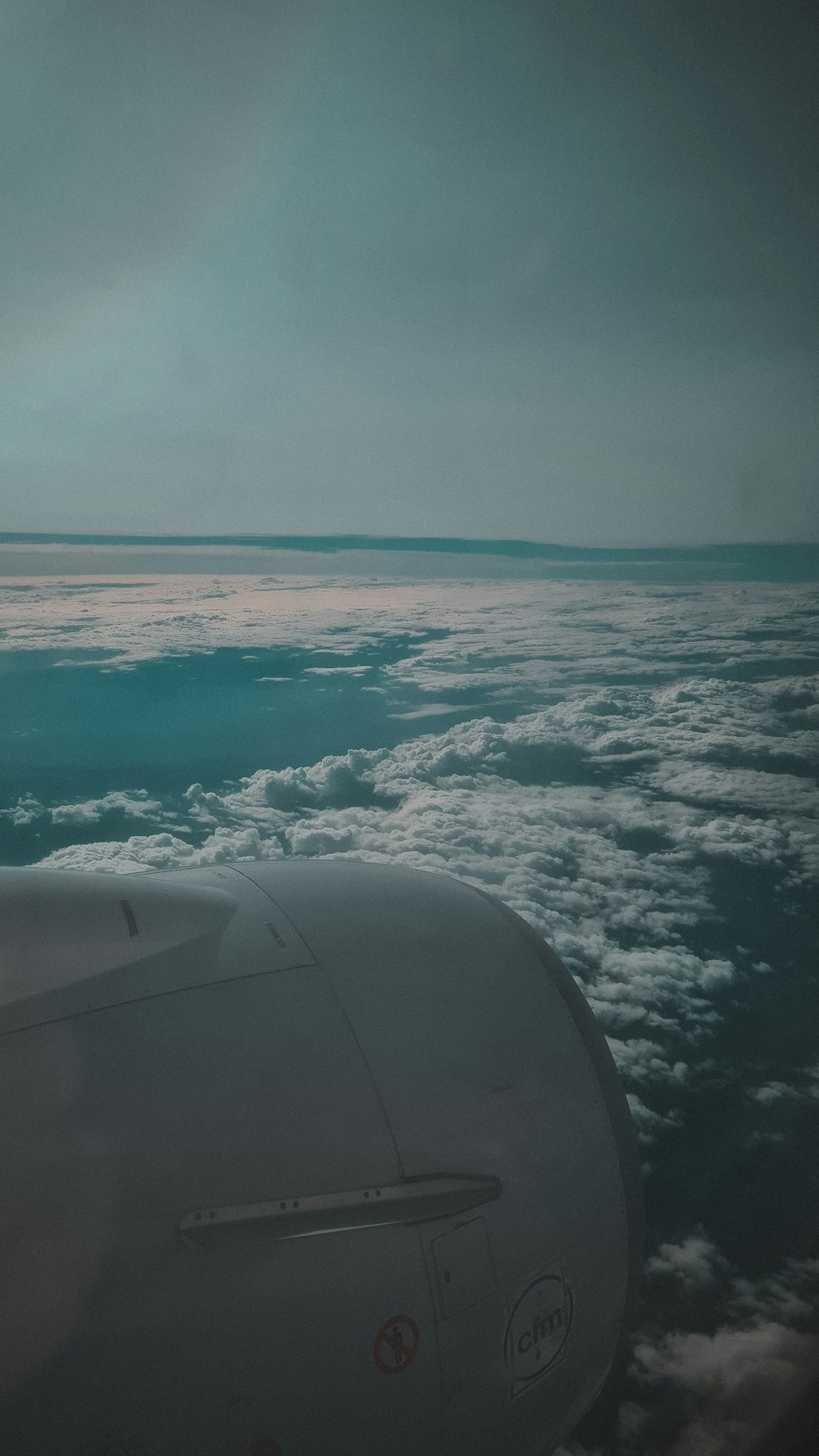 a view of the wing of an airplane in the sky