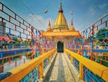 a brightly colored bridge over a body of water