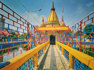 a brightly colored bridge over a body of water