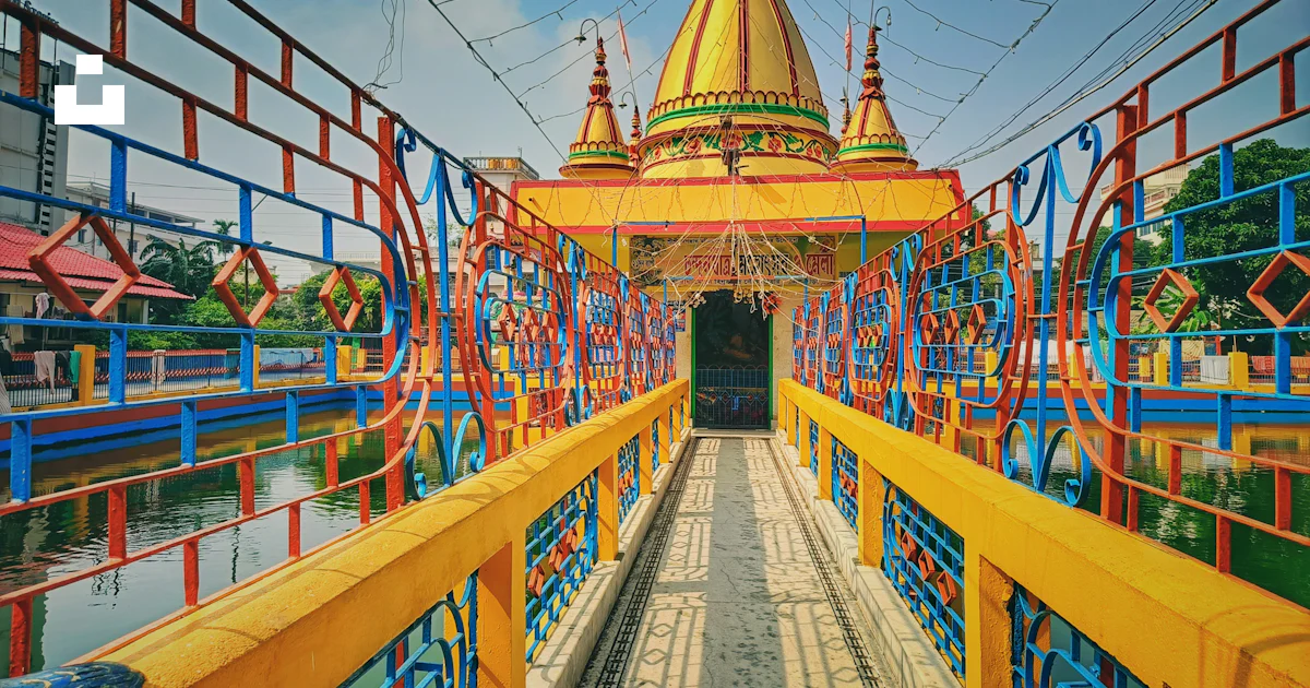 A brightly colored bridge over a body of water photo – Free Palace ...