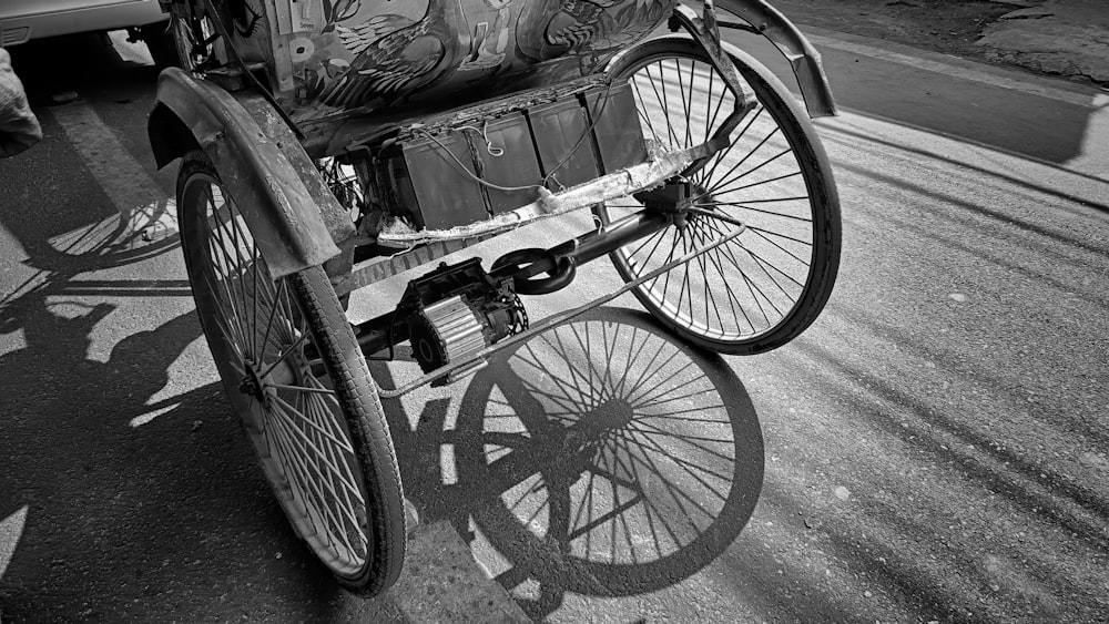 a black and white photo of a horse drawn carriage