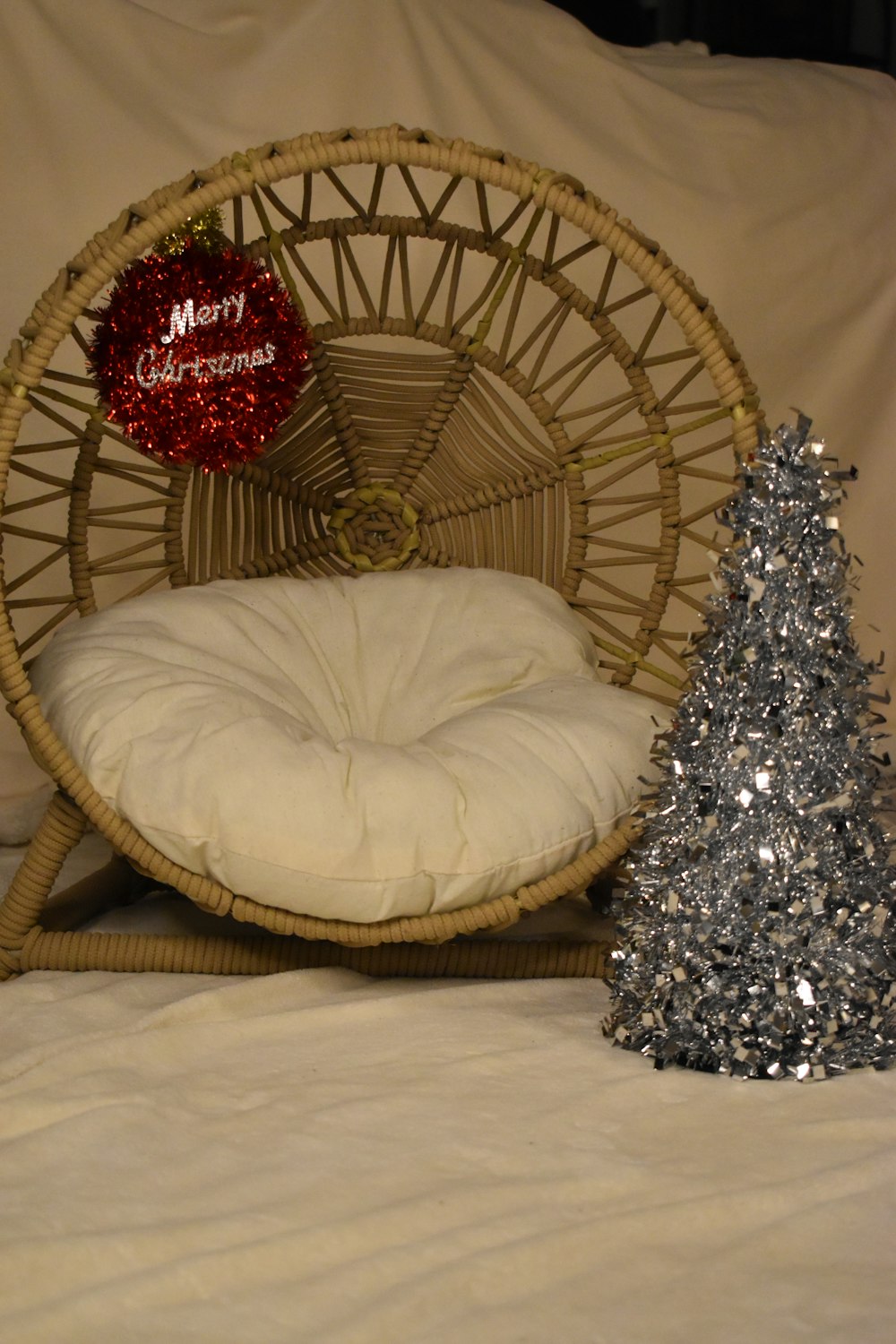 a chair with a christmas tree next to it