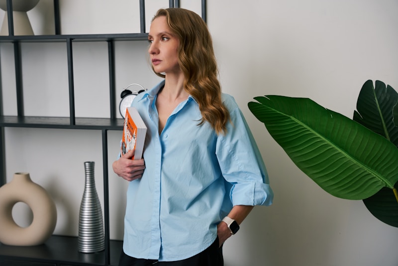 a woman standing in front of a shelf holding a bottle