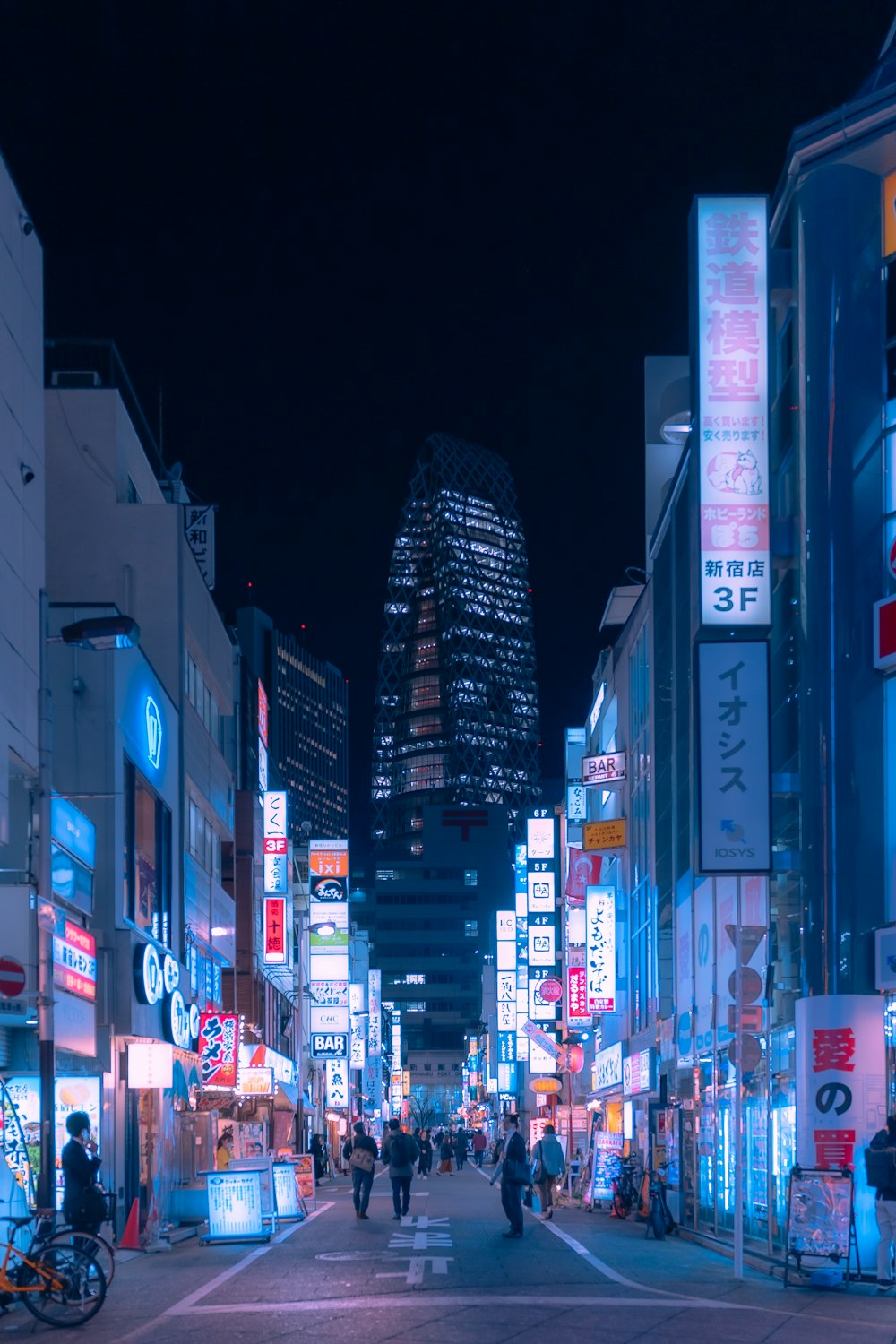 a city street filled with lots of tall buildings