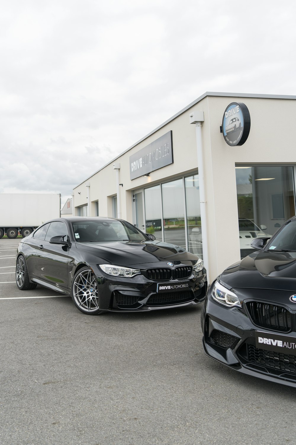 two cars parked in front of a building