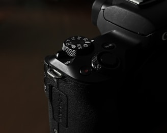 A close-up shot of camera buttons and dials, showcasing the craftsmanship of the device.