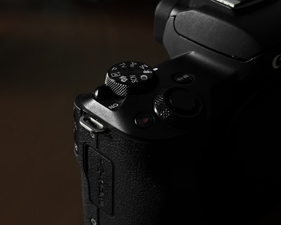 A close-up shot of camera buttons and dials, showcasing the craftsmanship of the device.
