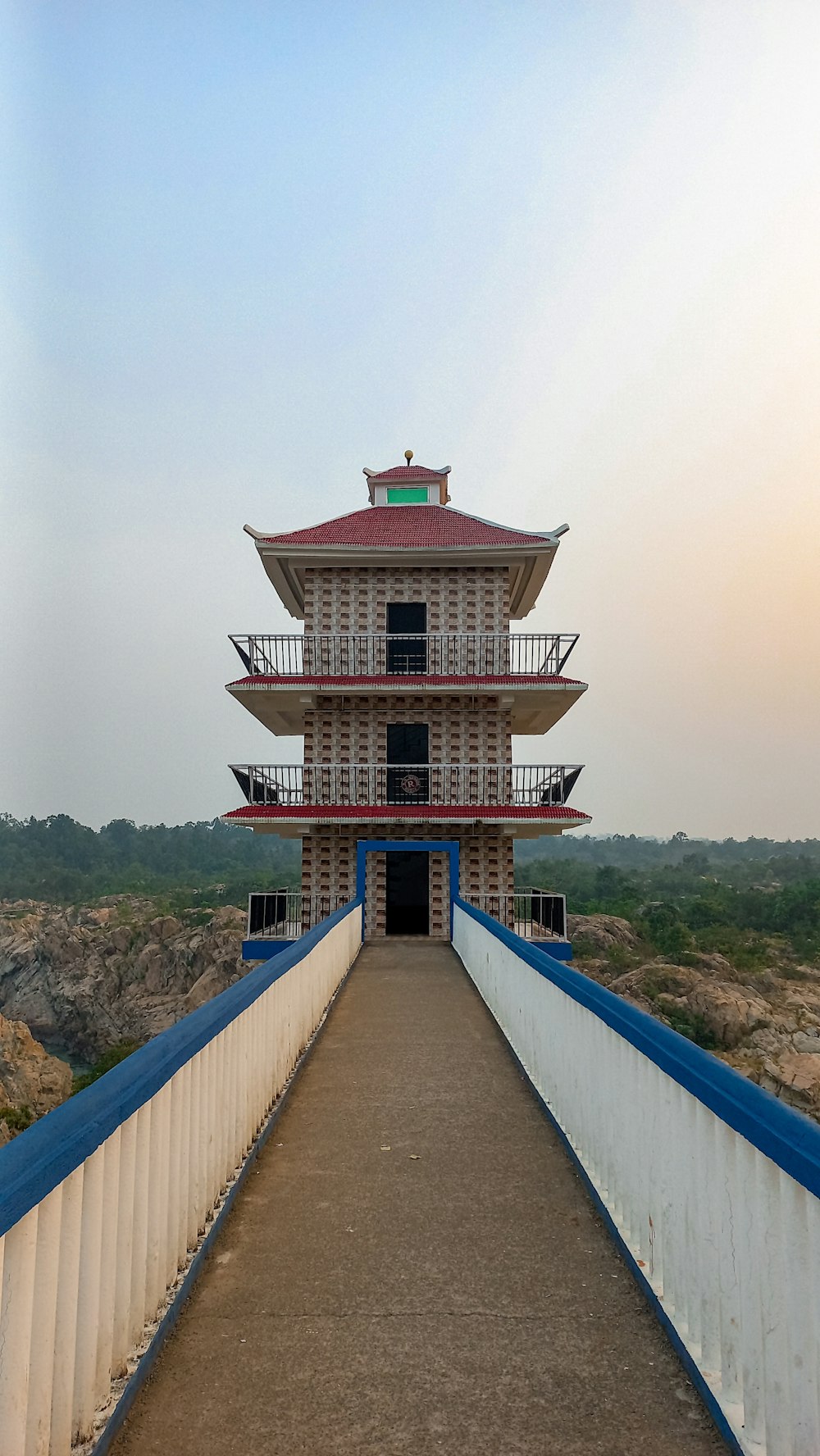 a tall building sitting on top of a bridge