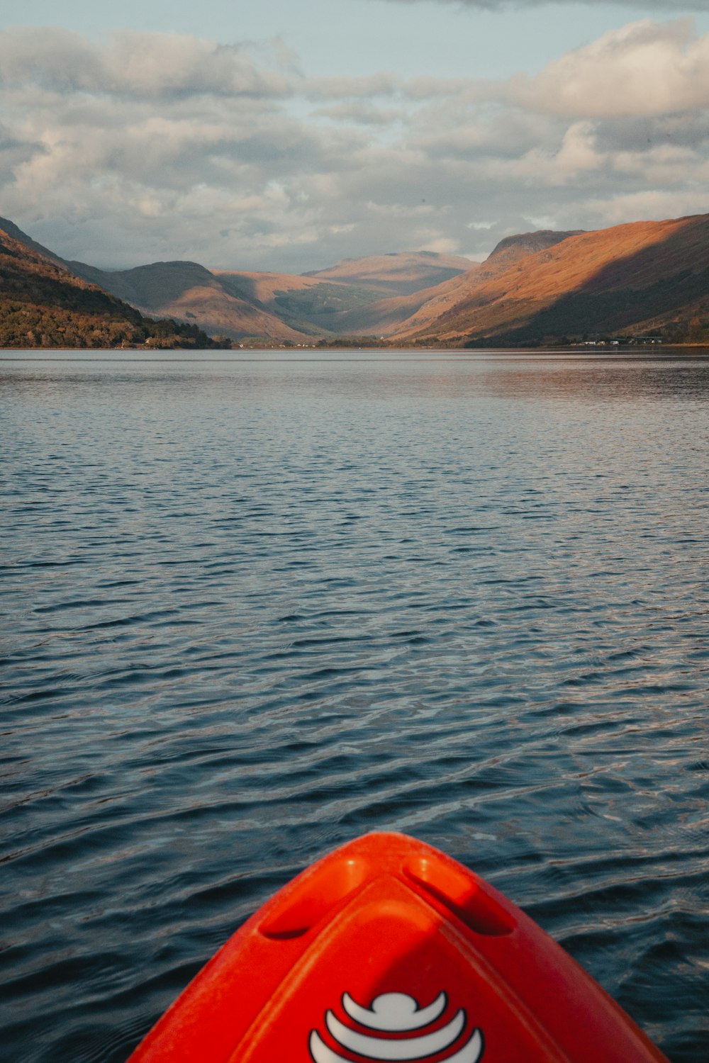 a view of a body of water with mountains in the background