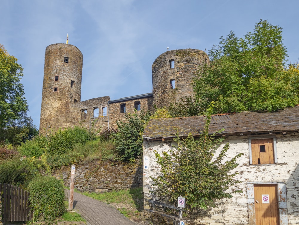 a stone building with two towers on top of it