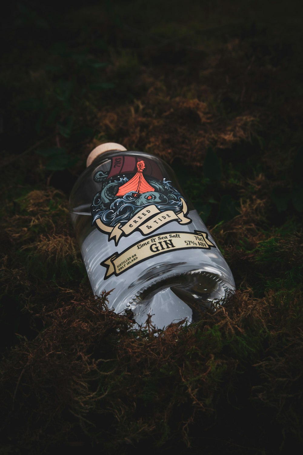 a water bottle that is laying in the grass