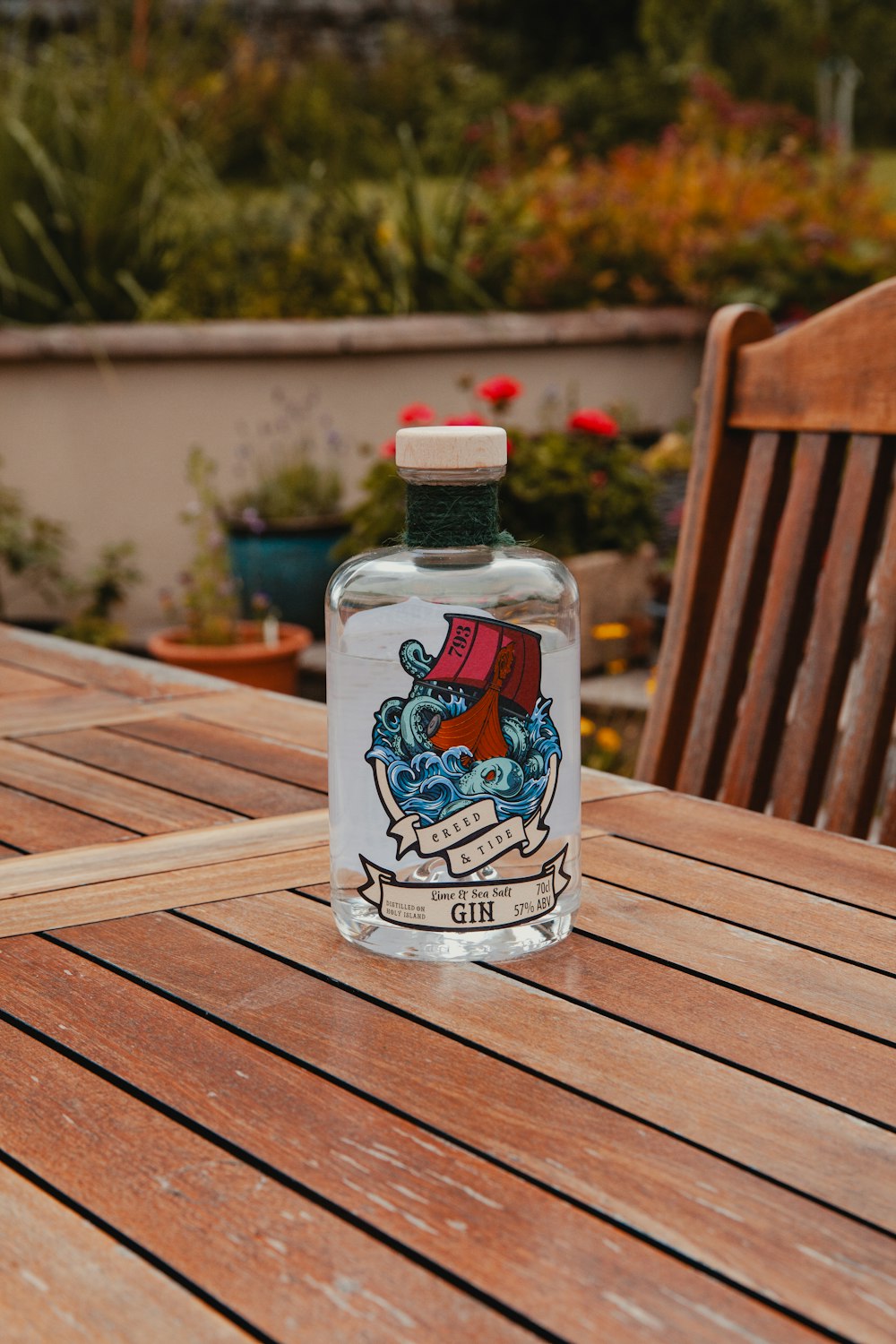 a bottle of water sitting on top of a wooden table