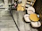 A cozy corner of Vinovibe Bistro with guests enjoying wine and small plates under warm lighting.