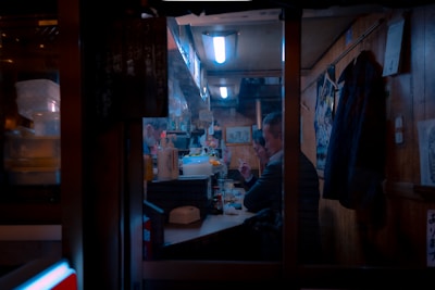 A smiling couple enjoying their meal in the intimate corner of the restaurant.
