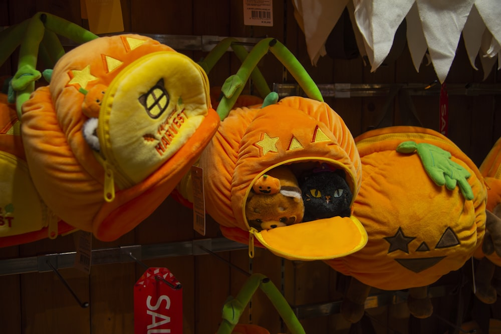 a group of pumpkins that are on a shelf