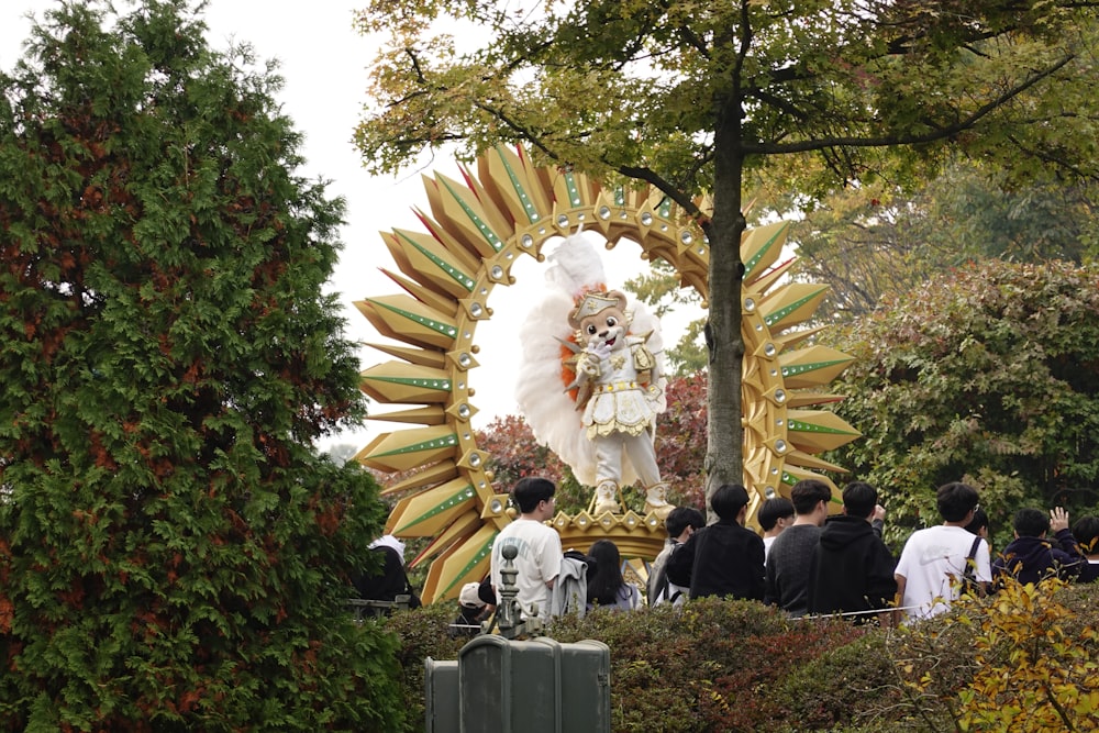 a group of people standing in front of a float