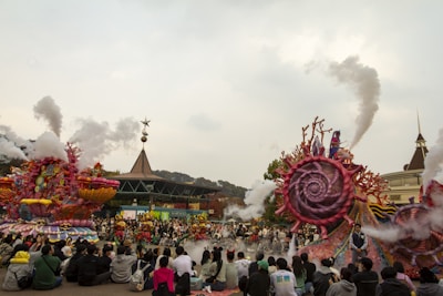 Pedro Ferrari guiding a small group through a colorful theme park parade.