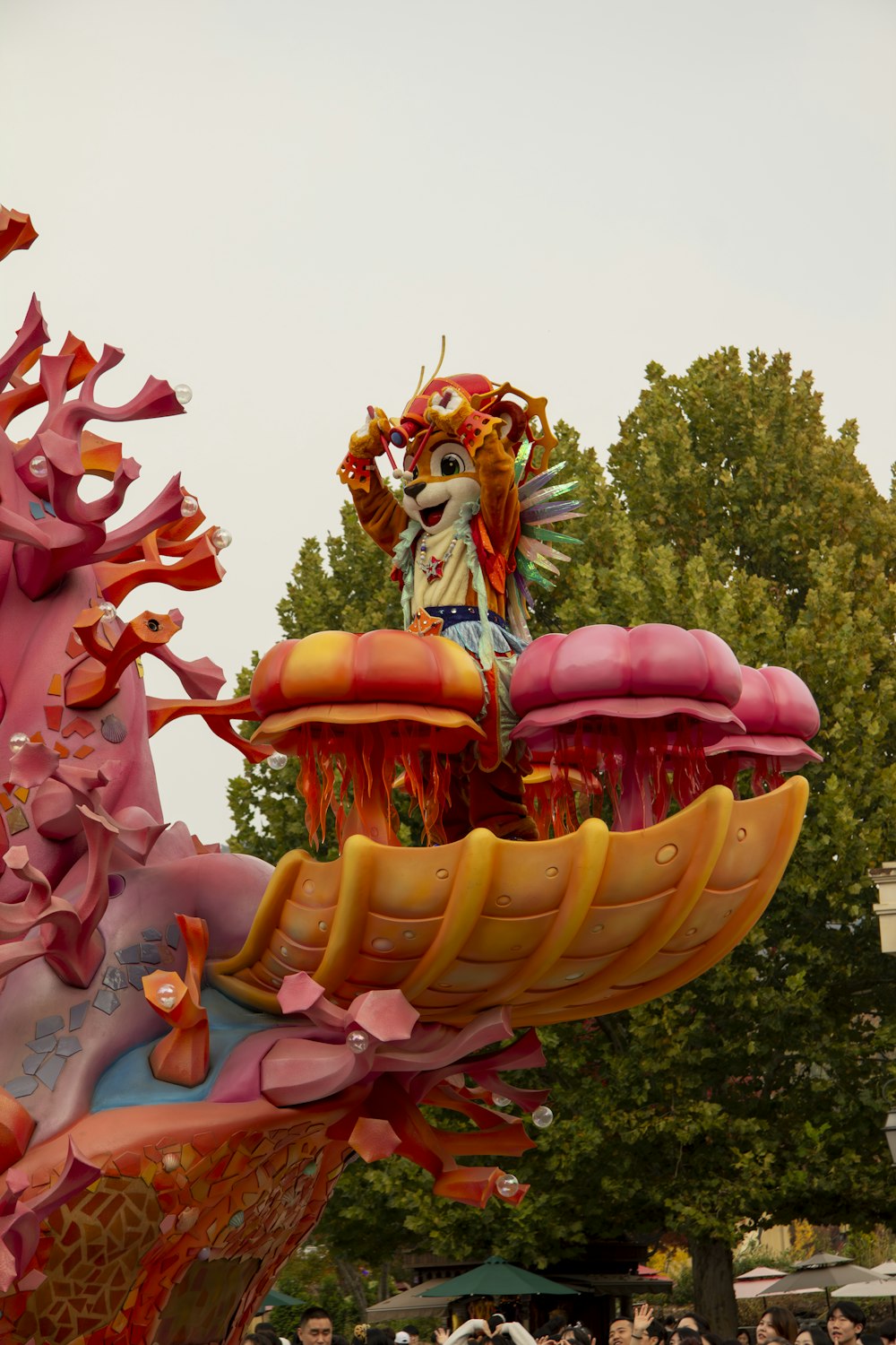 a parade float with a dragon on top of it