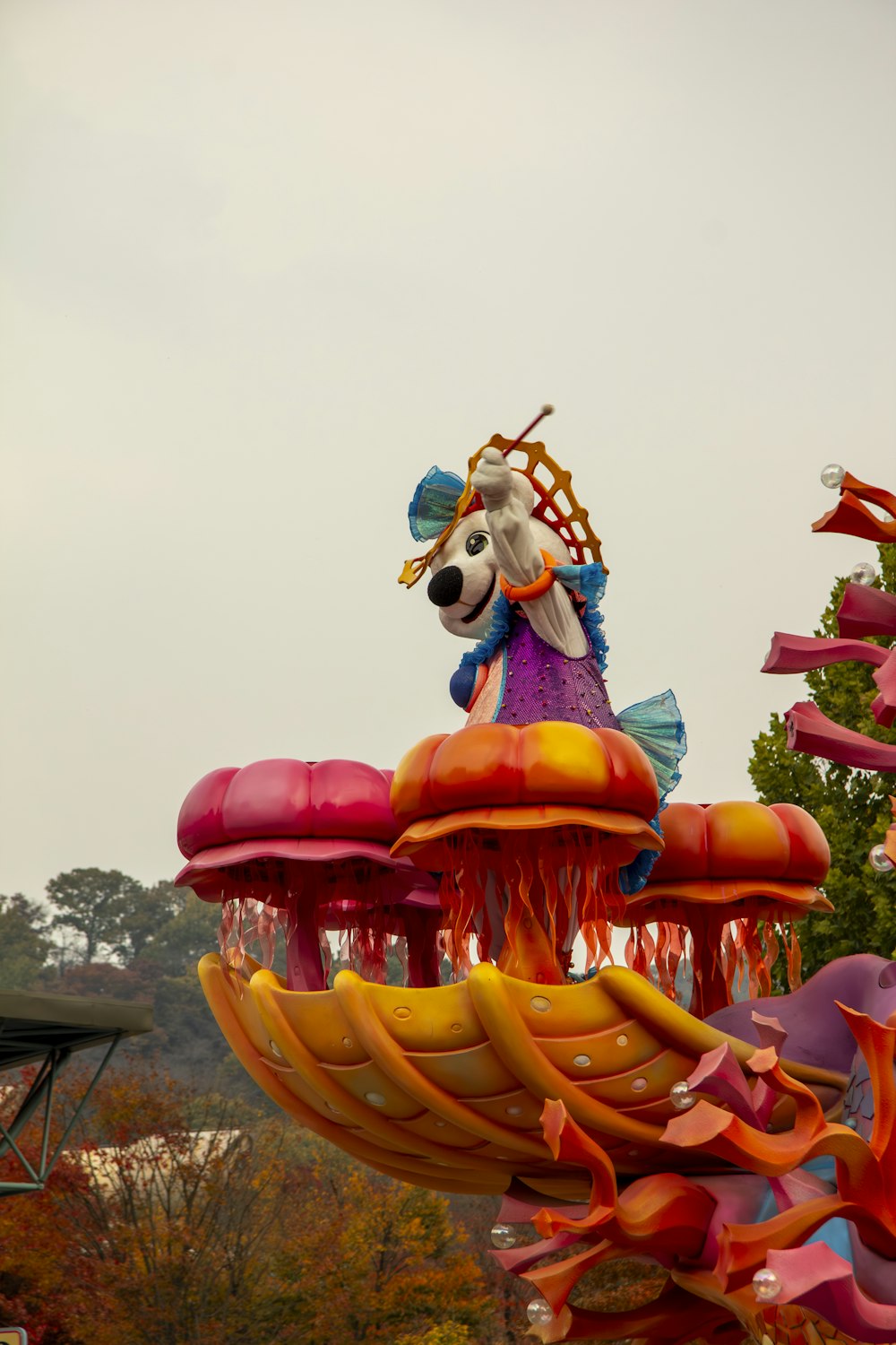 a carnival float with a dog on top of it