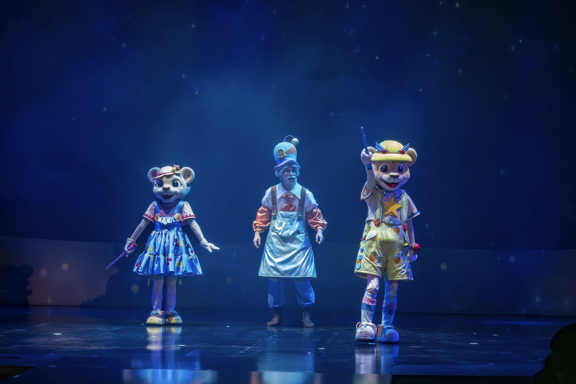 a group of people standing on top of a stage
