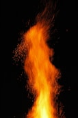 a close up of a fire on a black background