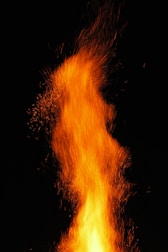 a close up of a fire on a black background