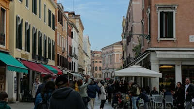 Travelers enjoying a vibrant city street filled with culture.