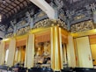 An elegant wooden temple adorned with intricate carvings.