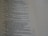 A close-up of a page from a book featuring text with religious or poetic content. The text is presented in a clear, serif font, and the page has a light beige background. The text includes verse numbers and appears to be structured in poetic lines.