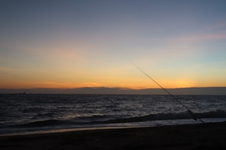 A tranquil sunset view over a fishing spot in the UK.