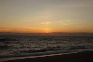 A serene beach sunset over the Mediterranean Sea, capturing the essence of tranquility.