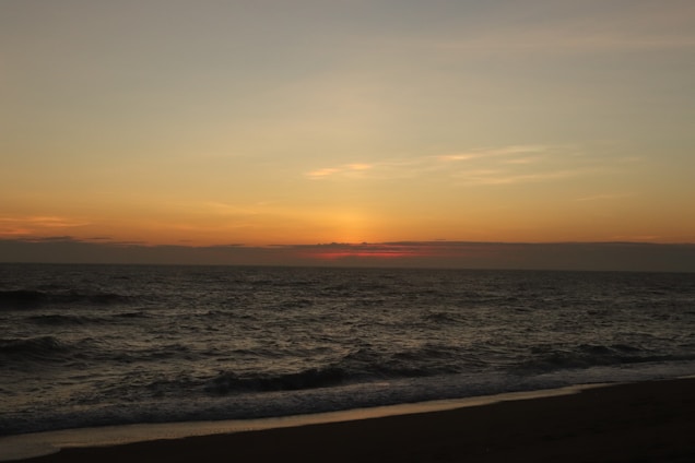 A serene beach sunset over the Mediterranean Sea, capturing the essence of tranquility.