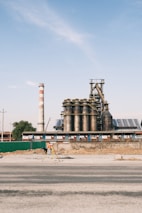 A professional conducting a risk engineering survey at an industrial site.