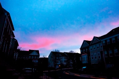 Evening view of elegant residential towers subtly lit against the twilight.