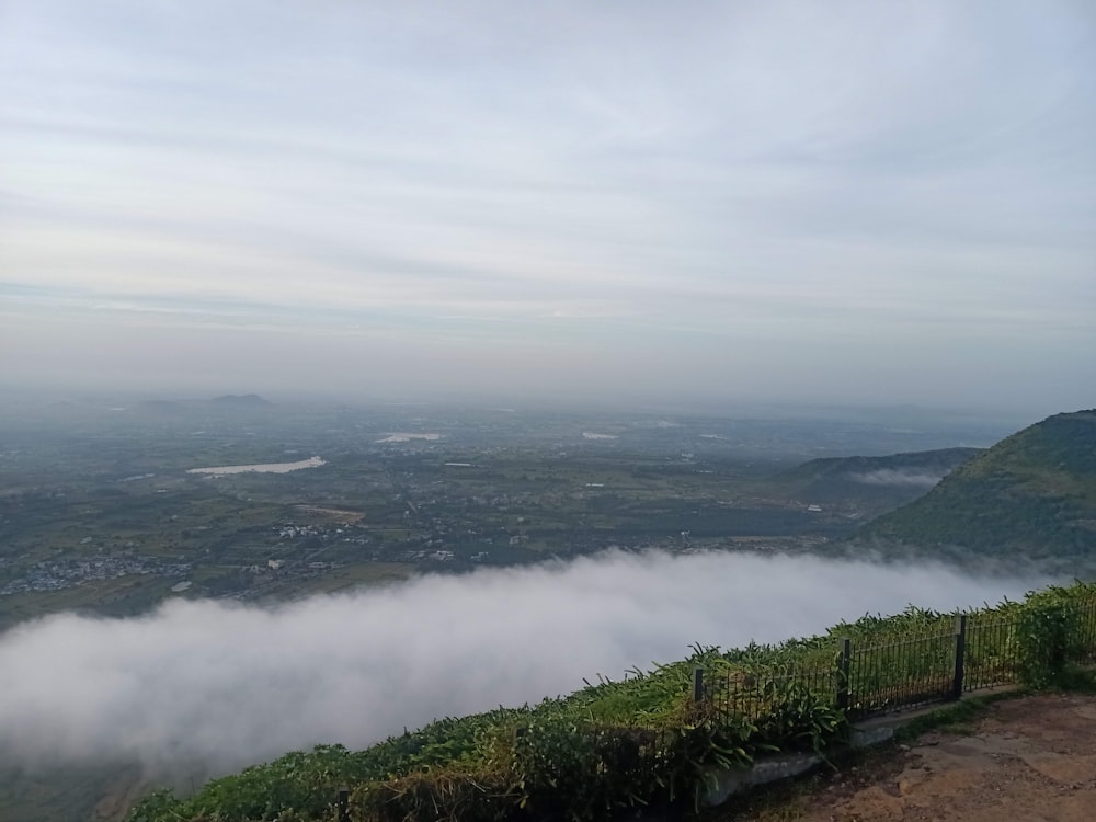 a bench on a hill overlooking a valley