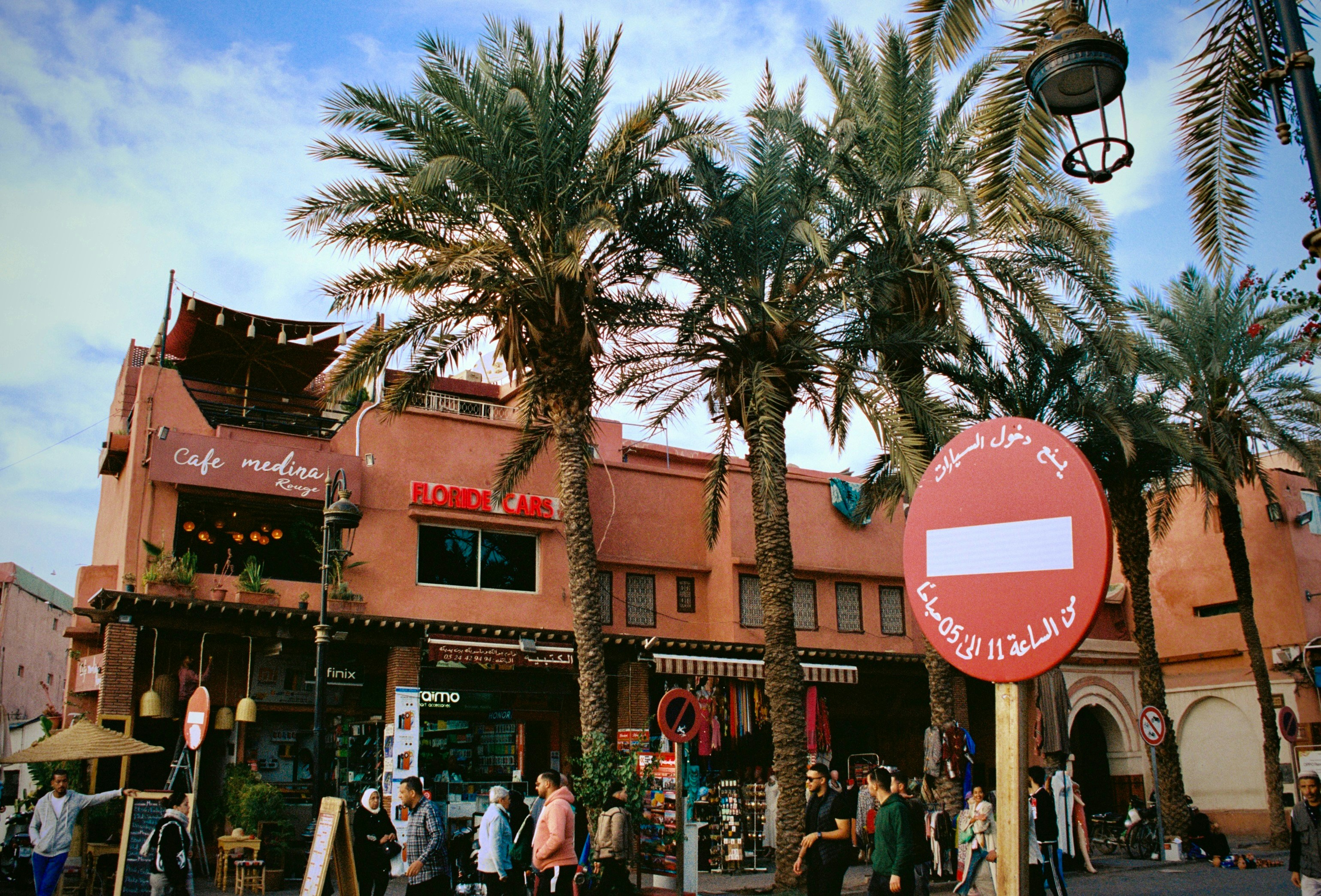 a group of people standing outside of a building, Street in Morocco