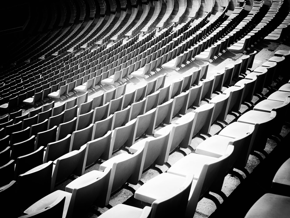 a black and white photo of a row of empty seats