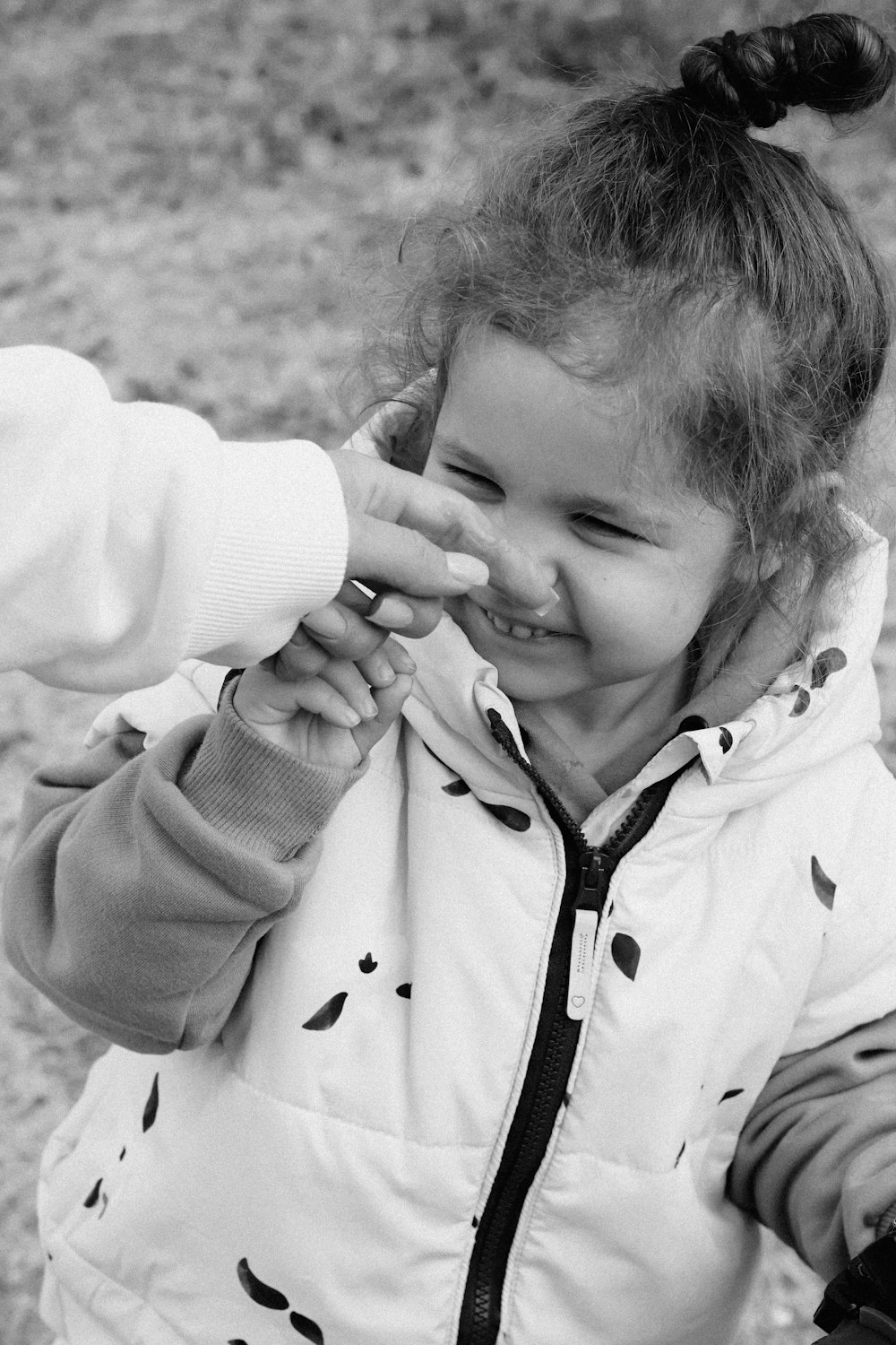 a little girl holding a toothbrush in her hand