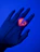 Close-up of a hand wearing the sleek herz p1 smart ring glowing softly in natural light