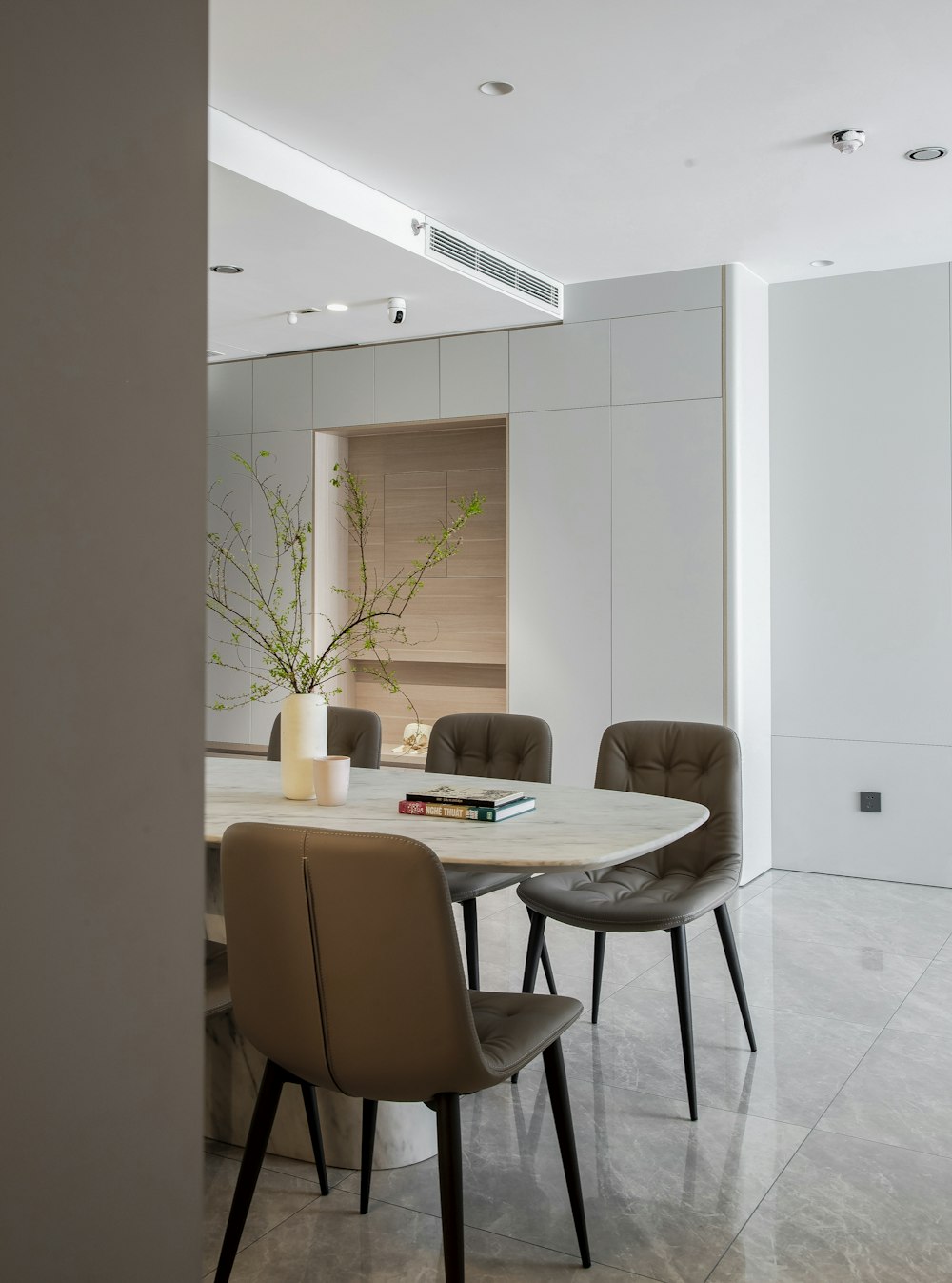 a dining room with a table and chairs