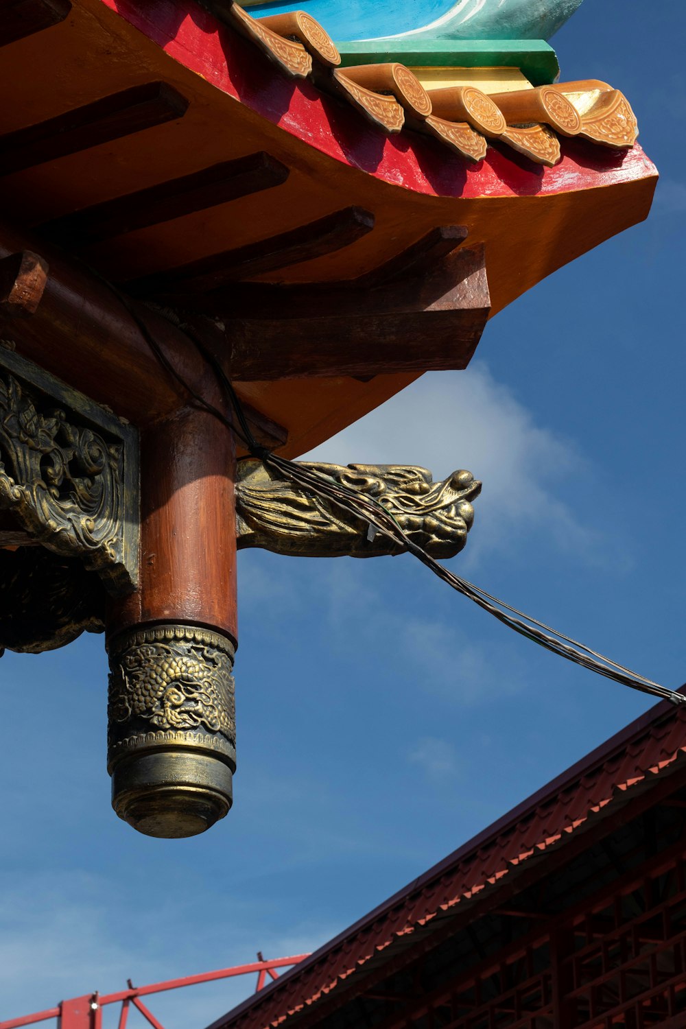 a close up of a wooden structure with a sky in the background