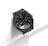 A stylish wristwatch with a metallic band and a black round face featuring Roman numerals and multiple dials, set against a minimalist white background.