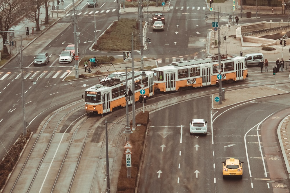 a couple of buses that are sitting in the street