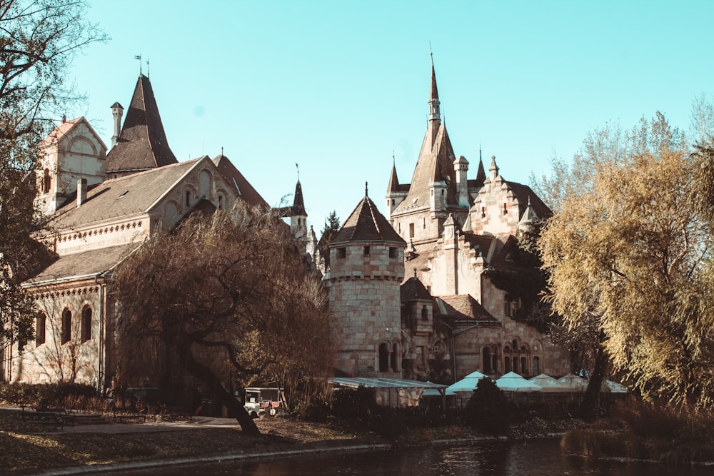 an old castle with a lake in front of it