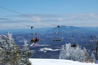A scenic view of a French ski resort with children skiing.