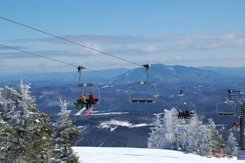 A scenic view of a French ski resort with children skiing.