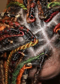 Close-up of beautifully finished braids showcasing vibrant textures and patterns.