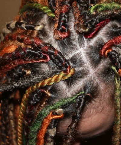 Close-up of beautifully finished braids showcasing vibrant textures and patterns.